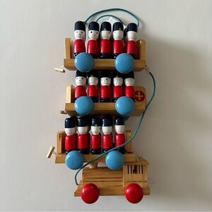 Vintage Wooden Train Pull Toy with 30 Peg Toy Soldiers.